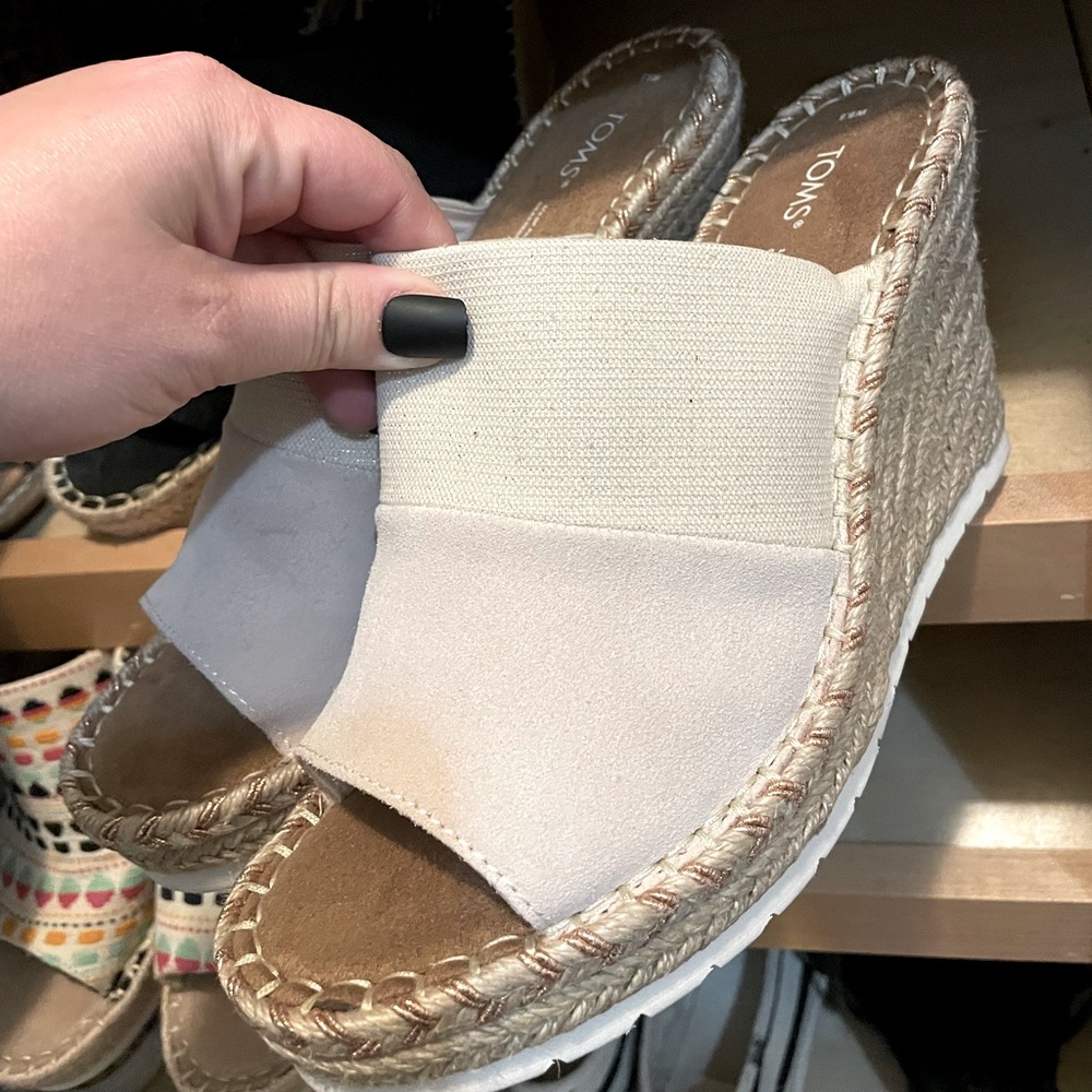 Brand new TOMS wedges in a nude color